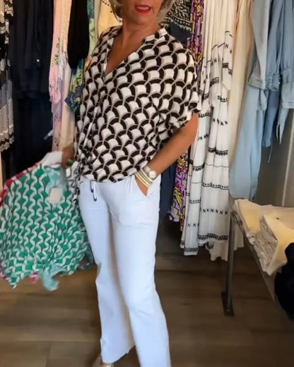 Blouse met V-hals en knoopdetail