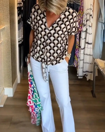 Blouse met V-hals en knoopdetail